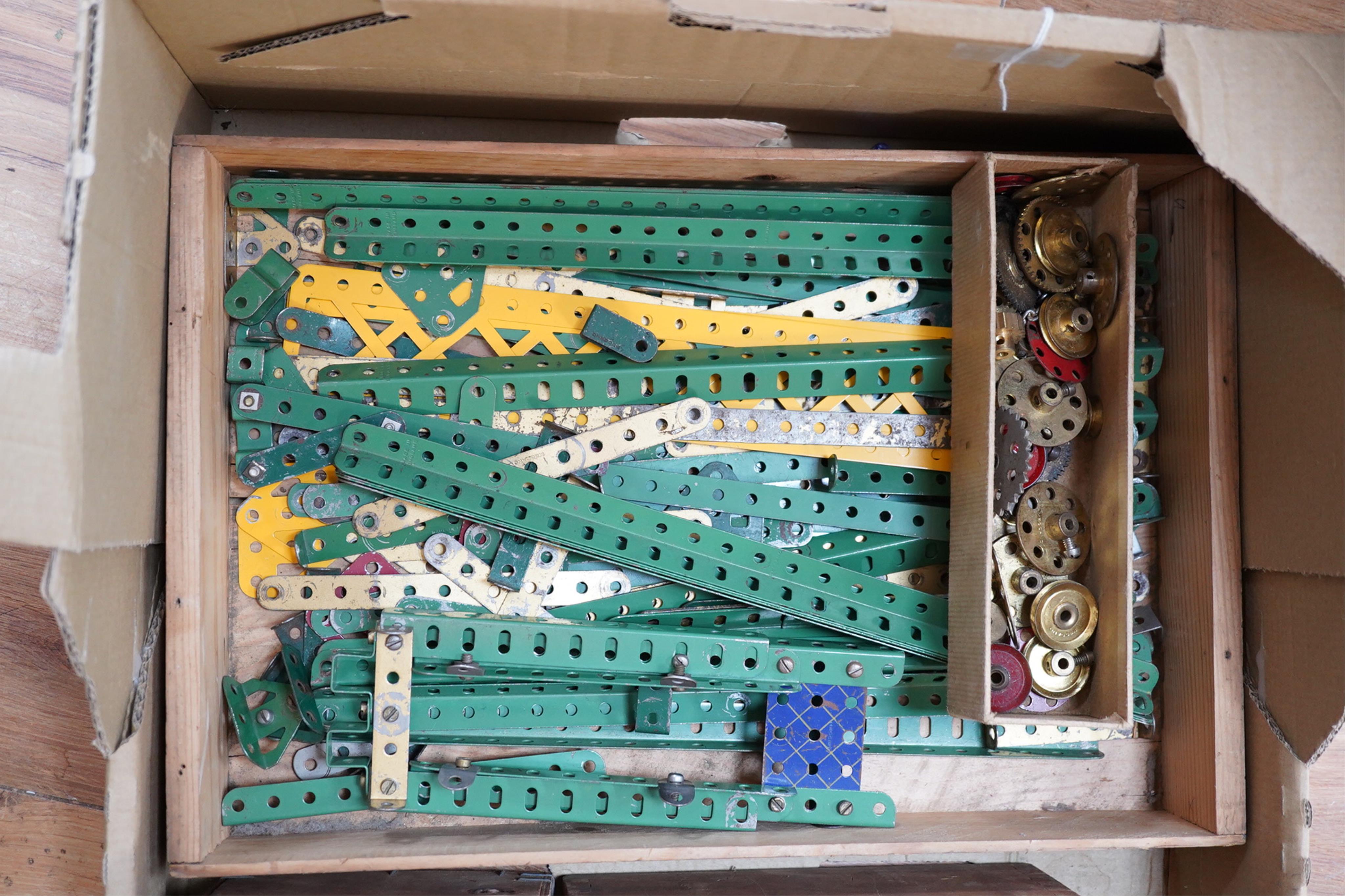 A collection of Meccano parts, including aeroplane parts, instruction manuals, etc. Condition - fair